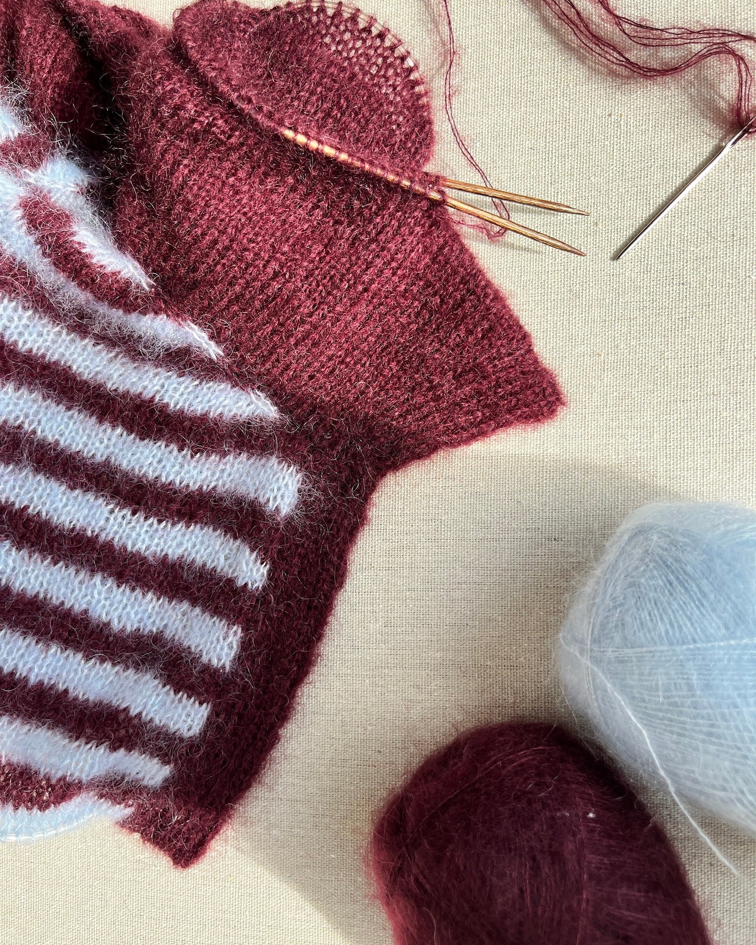 In-progress maroon and white striped knitted polo project