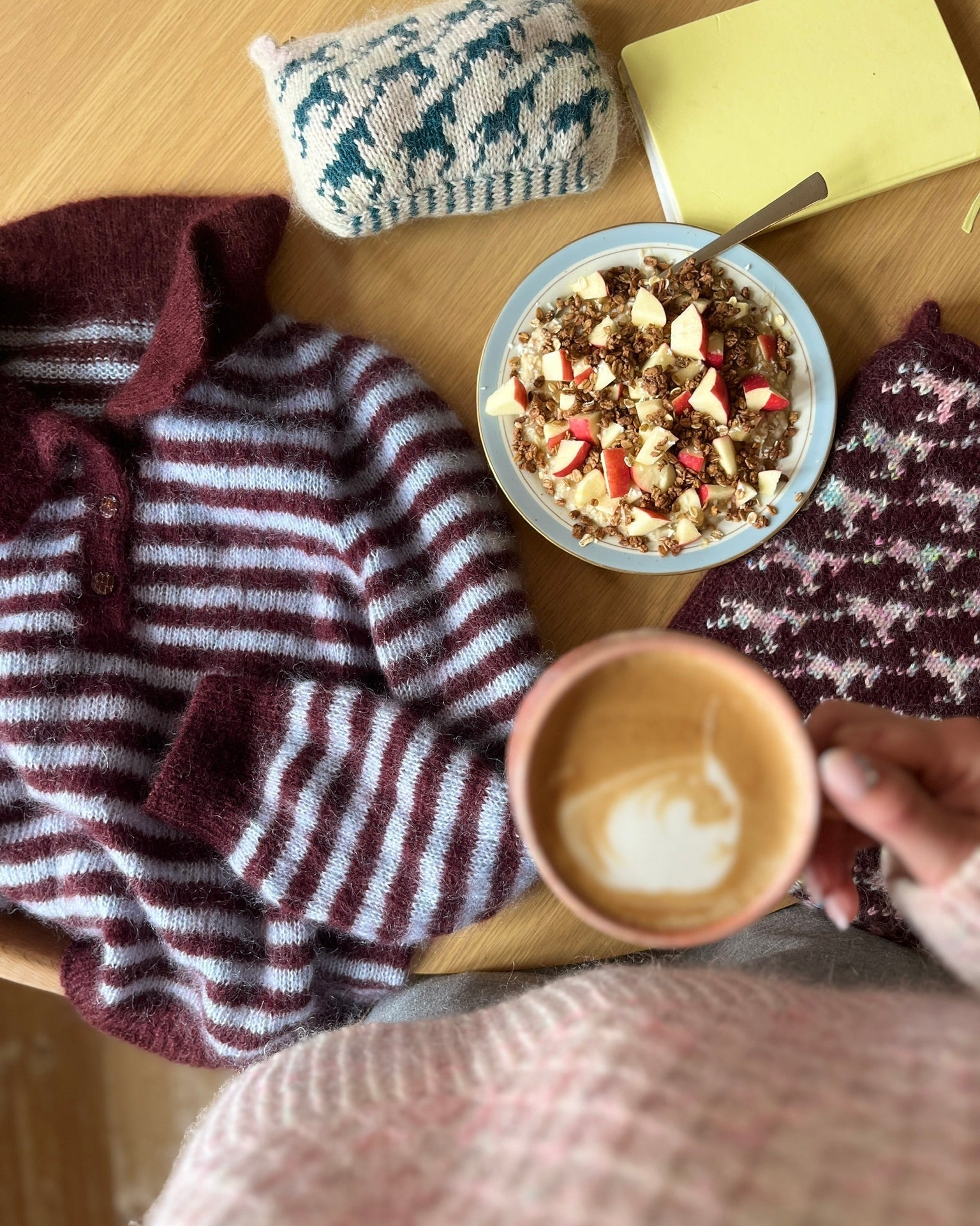 Maroon and gray striped knitted polo sweater flat lay with coffee