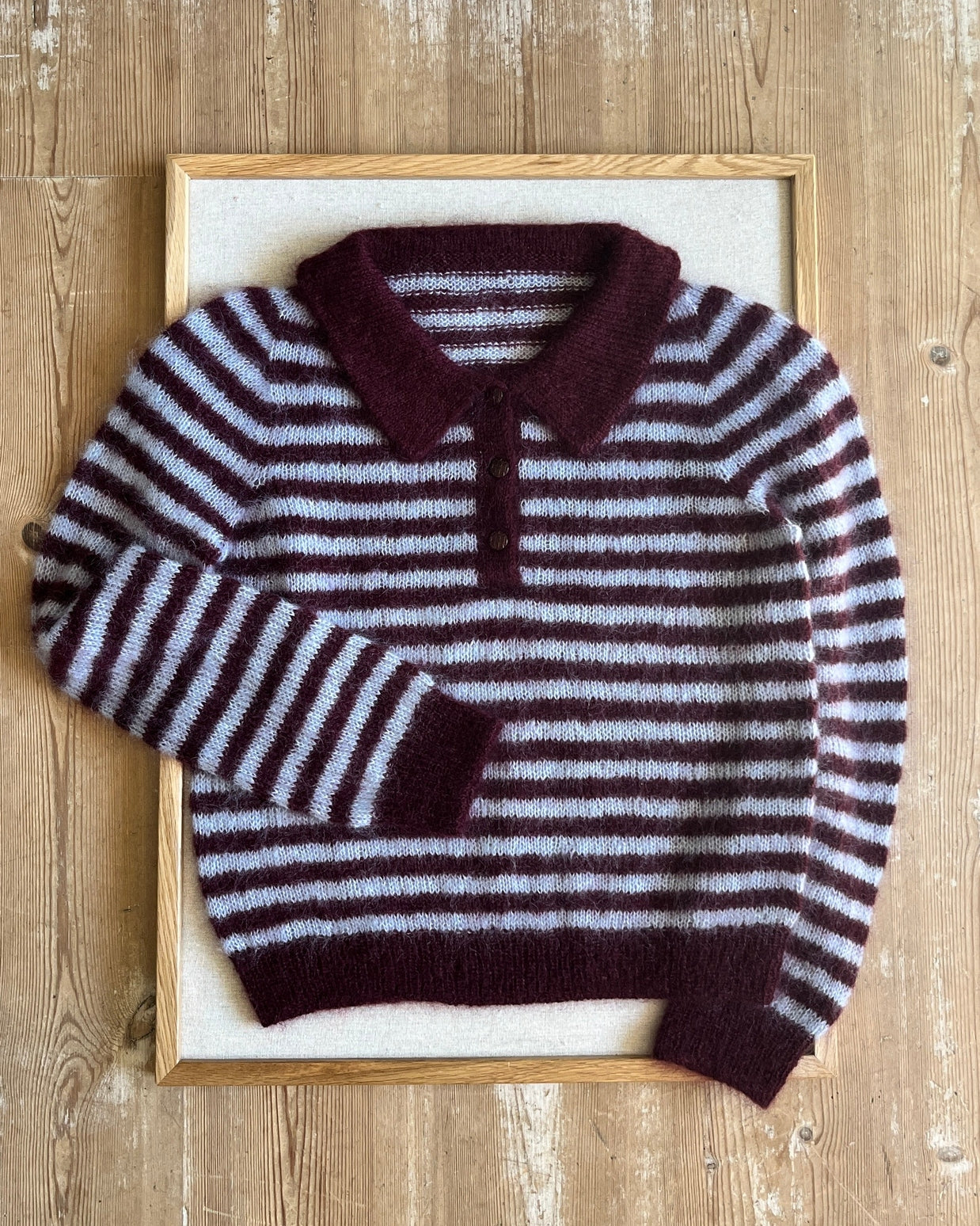 Maroon and gray striped mohair polo sweater flat lay detail