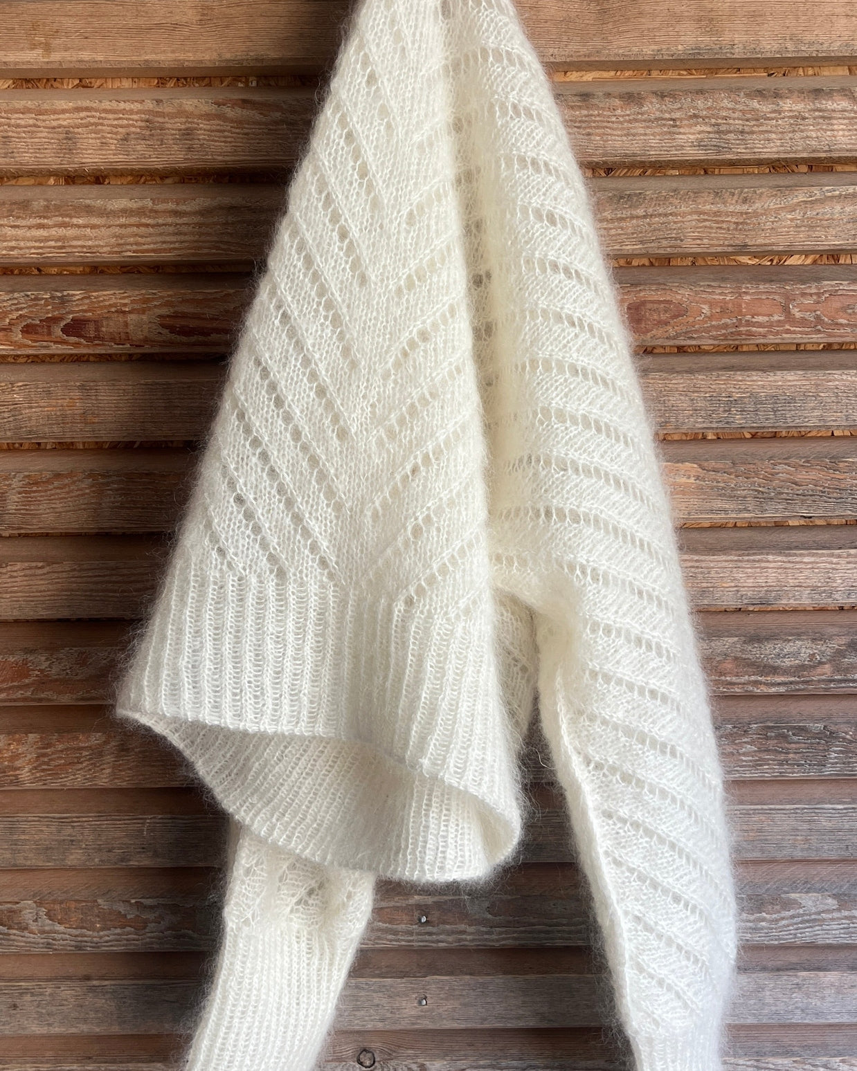Cream Go West cropped sweater with deep V-neck, batwing sleeves and diagonal openwork knit pattern